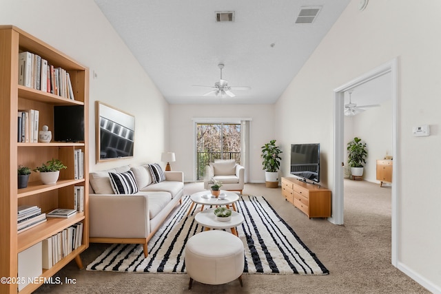 carpeted living room with lofted ceiling and ceiling fan