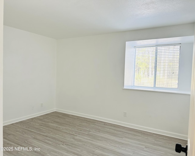 8880 S Old Kings Rd Unit 5, Jacksonville, FL 32257 - unfurnished room featuring light hardwood / wood-style flooring