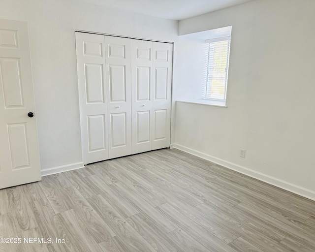 8880 S Old Kings Rd Unit 5, Jacksonville, FL 32257 - unfurnished bedroom featuring a closet and light wood-type flooring