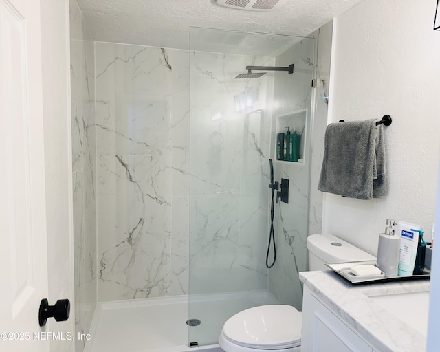 8880 S Old Kings Rd Unit 5, Jacksonville, FL 32257 - bathroom with vanity, a textured ceiling, toilet, and tiled shower