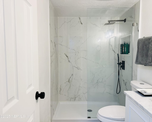 8880 S Old Kings Rd Unit 5, Jacksonville, FL 32257 - bathroom featuring vanity, a tile shower, a textured ceiling, and toilet