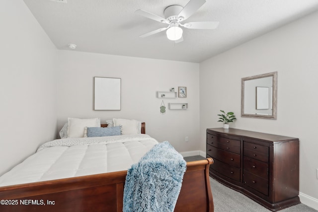 bedroom featuring light colored carpet and ceiling fan