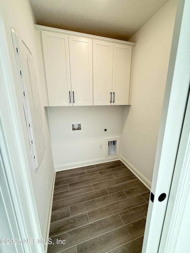 clothes washing area featuring hookup for a washing machine, baseboards, cabinet space, wood tiled floor, and electric dryer hookup