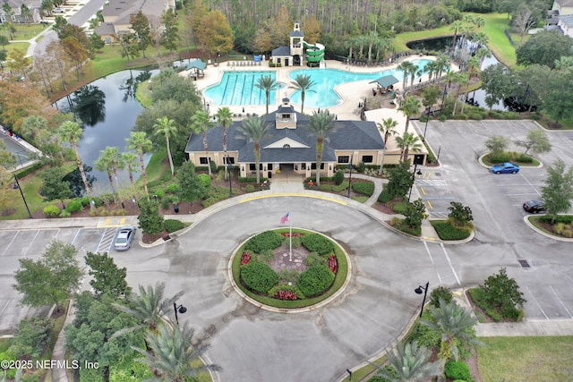 birds eye view of property with a water view