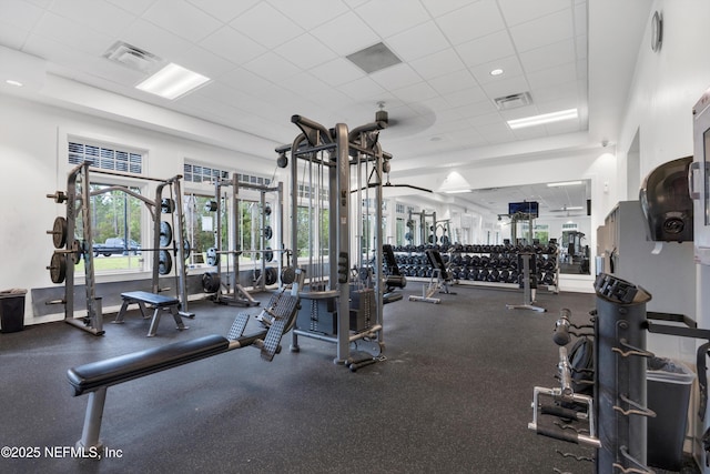 gym featuring a paneled ceiling