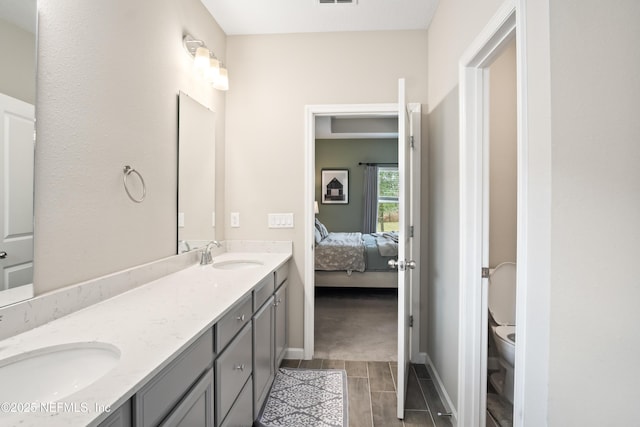 bathroom with vanity and toilet