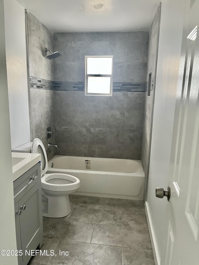 bathroom featuring shower / tub combination, toilet, and vanity