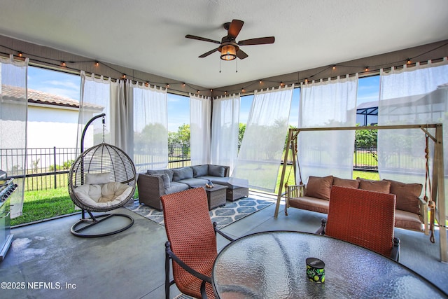 sunroom / solarium with ceiling fan