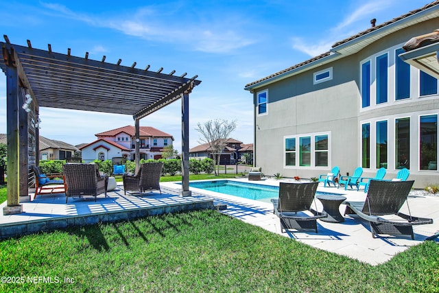 view of swimming pool featuring a pergola, a lawn, and a patio area