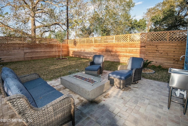 view of patio / terrace with an outdoor fire pit