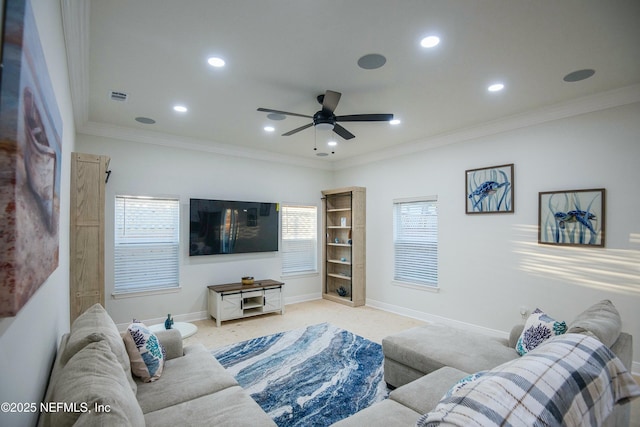 carpeted living room with crown molding and ceiling fan