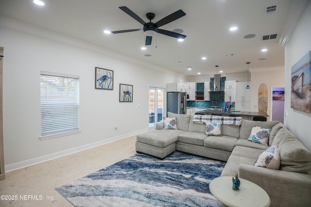 living room featuring ceiling fan and ornamental molding