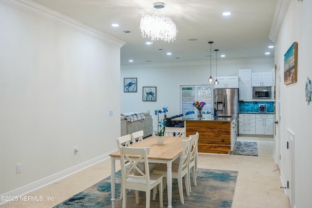 dining space featuring crown molding