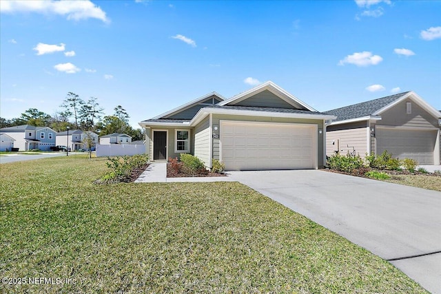 view of front of property featuring an attached garage, concrete driveway, and a front lawn