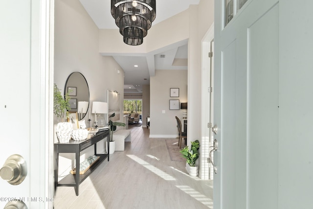 entrance foyer featuring a chandelier