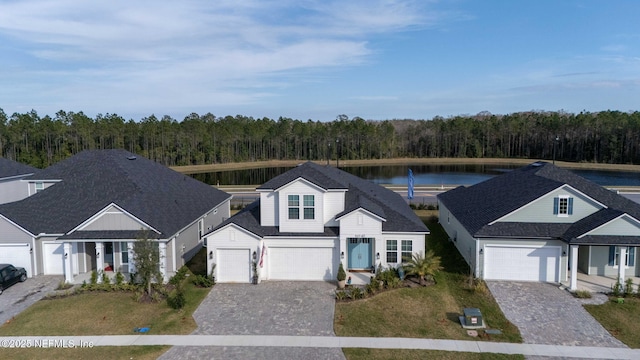 40 Holly Landing Way, Saint Augustine, FL 32092 - traditional-style home with a wooded view, decorative driveway, a water view, and a front yard