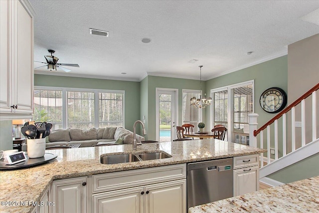 kitchen with open floor plan, light stone countertops, stainless steel dishwasher, white cabinetry, and a sink