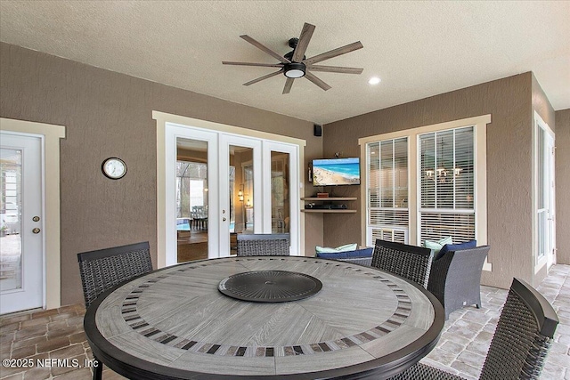 view of patio featuring ceiling fan, french doors, and outdoor dining space