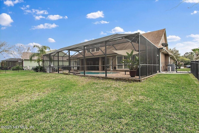 rear view of house featuring glass enclosure, a patio, a fenced backyard, central air condition unit, and a fenced in pool