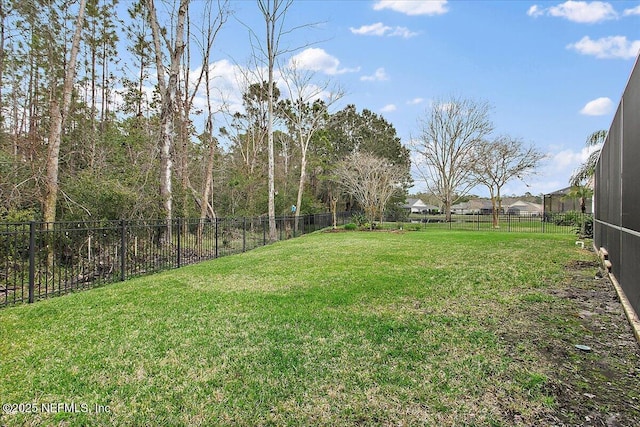 view of yard with a fenced backyard