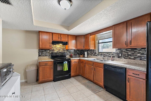 kitchen featuring a sink, black appliances, exhaust hood, and brown cabinets