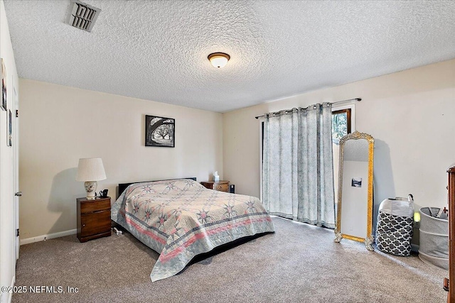 bedroom featuring carpet floors, baseboards, visible vents, and a textured ceiling