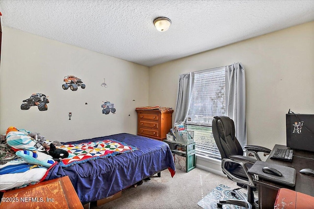 carpeted bedroom featuring a textured ceiling