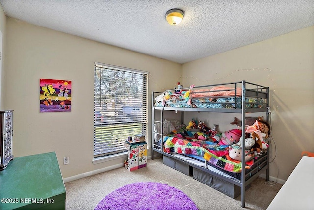 bedroom with a textured ceiling, multiple windows, carpet flooring, and baseboards