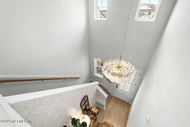 entryway featuring a chandelier and light wood-type flooring