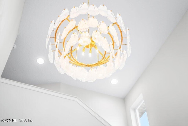 details with an inviting chandelier and recessed lighting