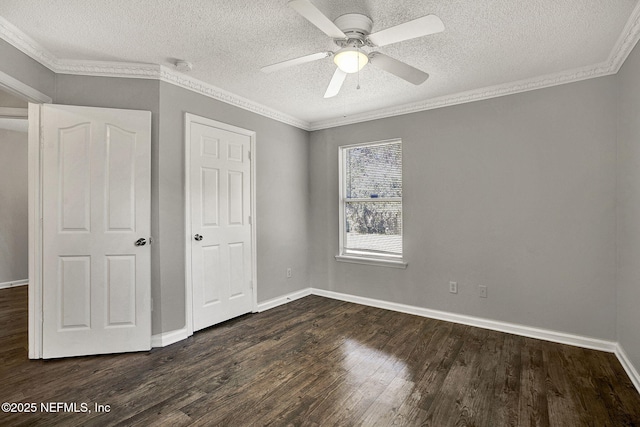 unfurnished bedroom with a textured ceiling, crown molding, and dark hardwood / wood-style floors