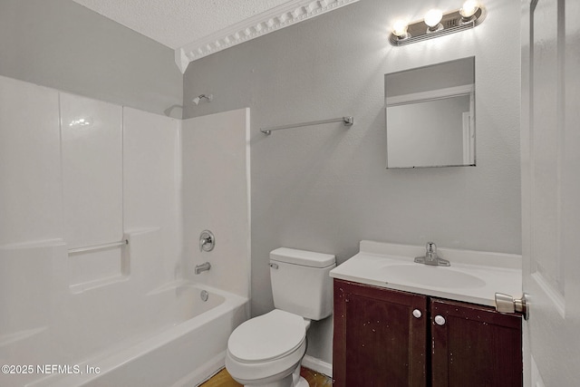 full bathroom with a textured ceiling, vanity,  shower combination, and toilet