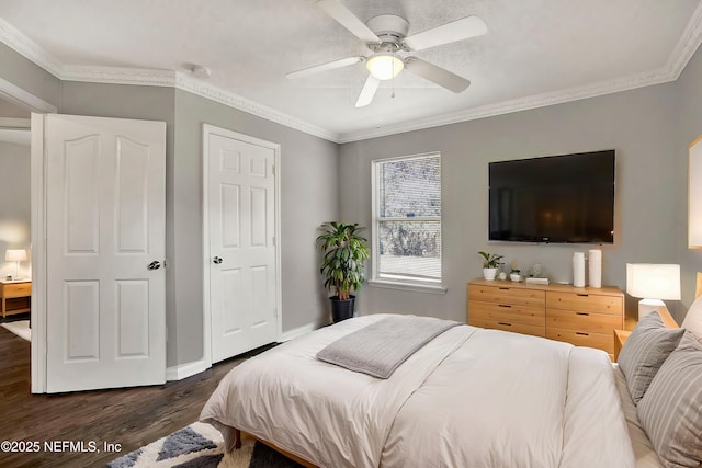 bedroom featuring ornamental molding, dark wood-type flooring, and ceiling fan