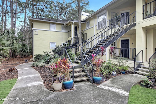 view of property's community featuring stairs