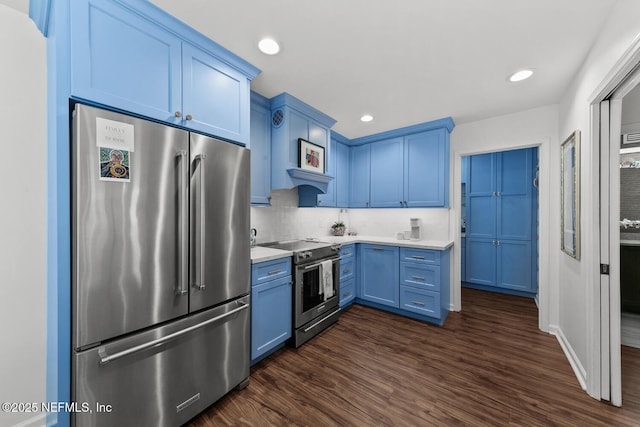 kitchen featuring light countertops, appliances with stainless steel finishes, and blue cabinets