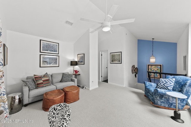 living area featuring baseboards, visible vents, a ceiling fan, vaulted ceiling, and carpet floors