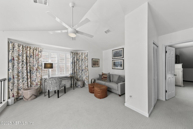 interior space featuring a ceiling fan, lofted ceiling, light carpet, and visible vents