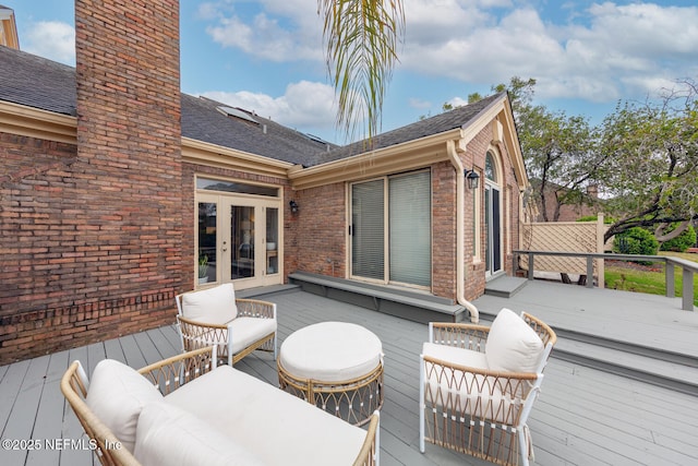 wooden deck featuring french doors