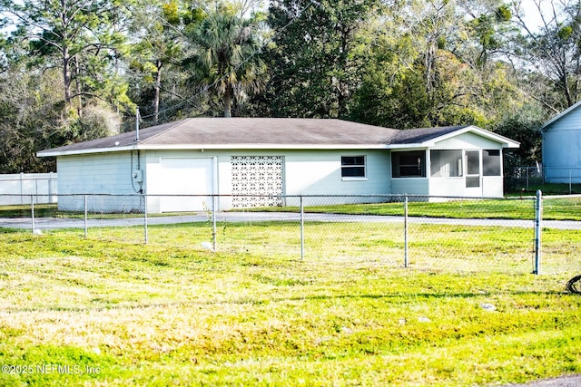 ranch-style house with a sunroom, fence, and a front lawn