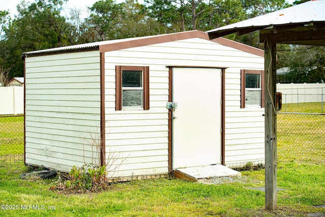 view of shed with fence