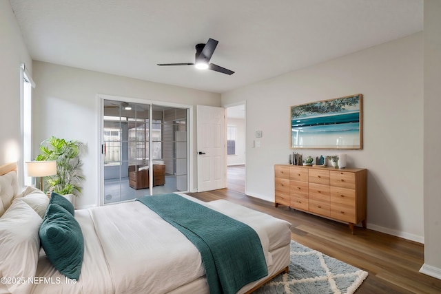 bedroom featuring ceiling fan, access to exterior, and dark hardwood / wood-style flooring