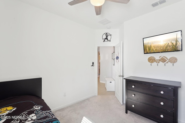 bedroom with a ceiling fan, light colored carpet, visible vents, and baseboards