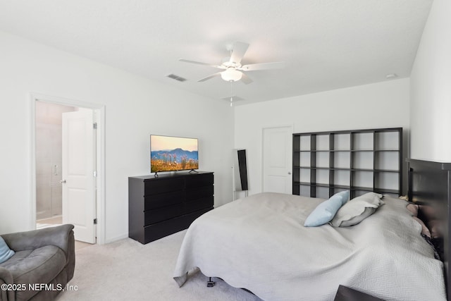 bedroom featuring a ceiling fan, visible vents, and light carpet