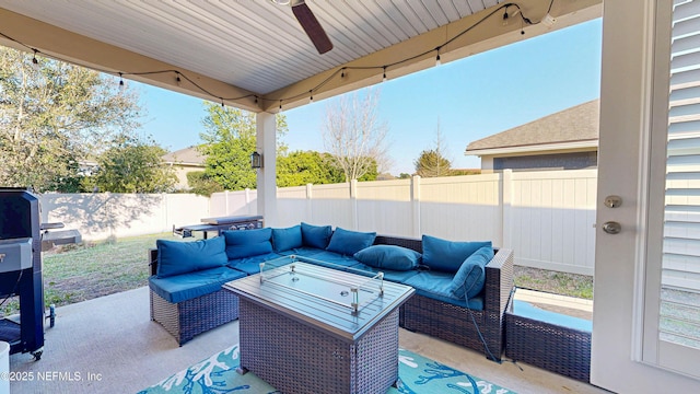 view of patio / terrace featuring a fenced backyard, outdoor lounge area, and a ceiling fan