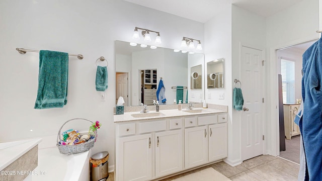 full bath with tile patterned flooring, a closet, a sink, and double vanity