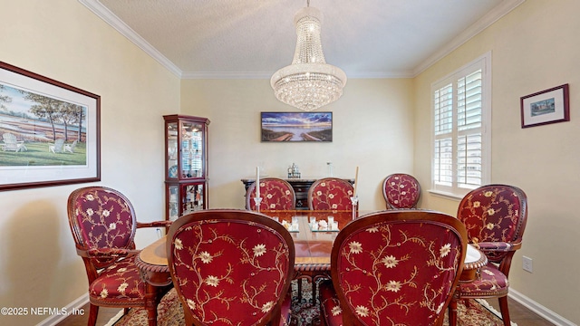 dining room with an inviting chandelier, baseboards, ornamental molding, and wood finished floors