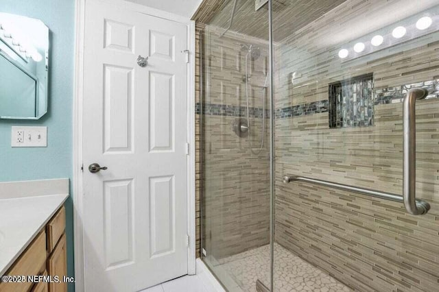 bathroom with vanity and walk in shower