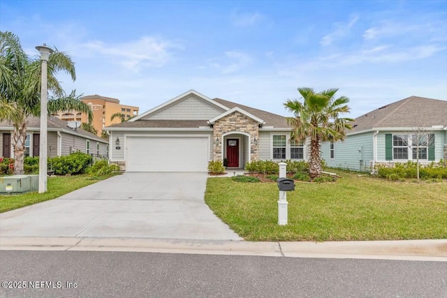 ranch-style house featuring a front yard, stone siding, driveway, and an attached garage