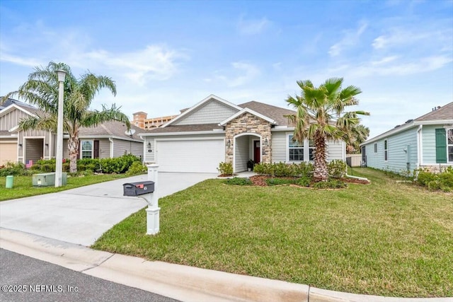 single story home featuring a garage, driveway, stone siding, and a front yard