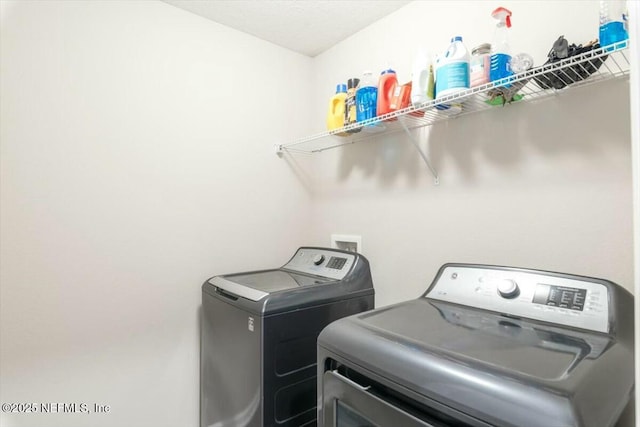 laundry room featuring laundry area and washer and clothes dryer